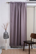 Purple linen semi-sheer curtains hanging in elegant bedroom