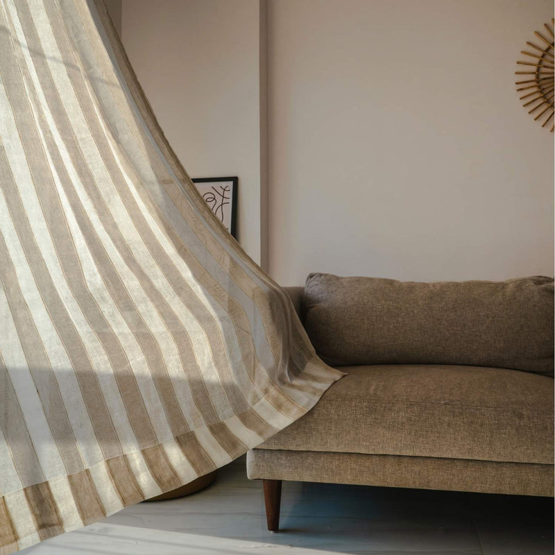 Striped linen sheer curtains in coastal living room with natural light