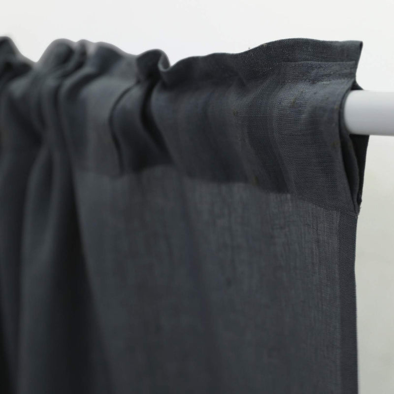 Close-up rod pocket of handwoven charcoal linen curtain