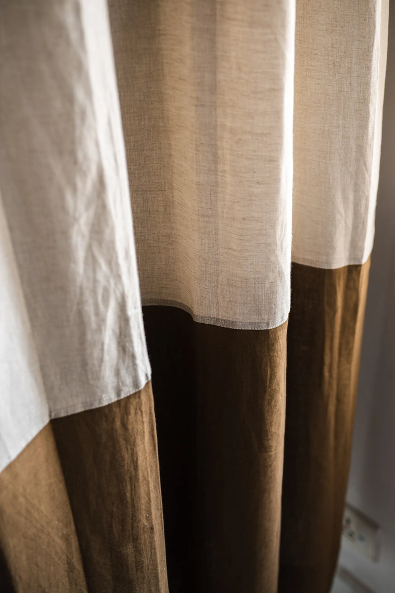 Close-up texture of handcrafted natural and brown linen color-blocked curtain panel